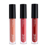 a beige, pink, and red lip gloss all standing in a row together